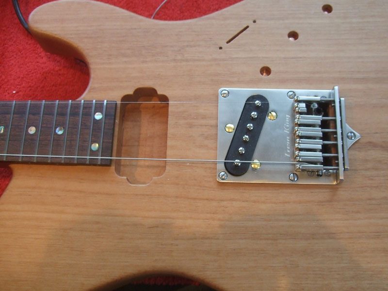 Bridge fitted with the E-strings to ensure everything lines up (very important, this!)
