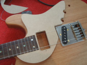 Trying the pickguard template for size