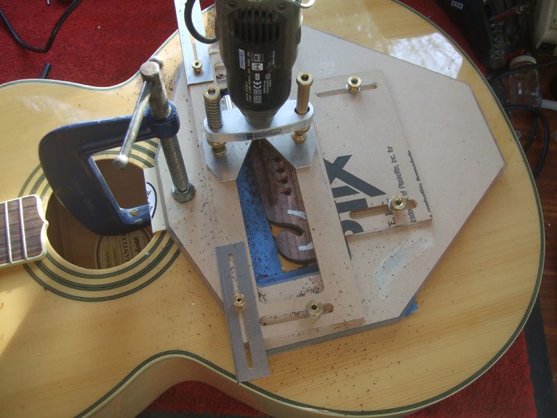 Using Stewmac saddle routing jig on Epiphone EJ 200 left hand conversion
